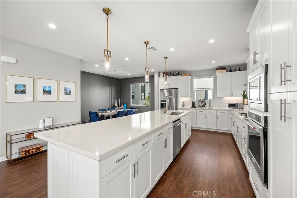 147 Schick Irvine, CA 92614 - Photo 16 of 35 a large white kitchen with lots of counter space a sink appliances and cabinets