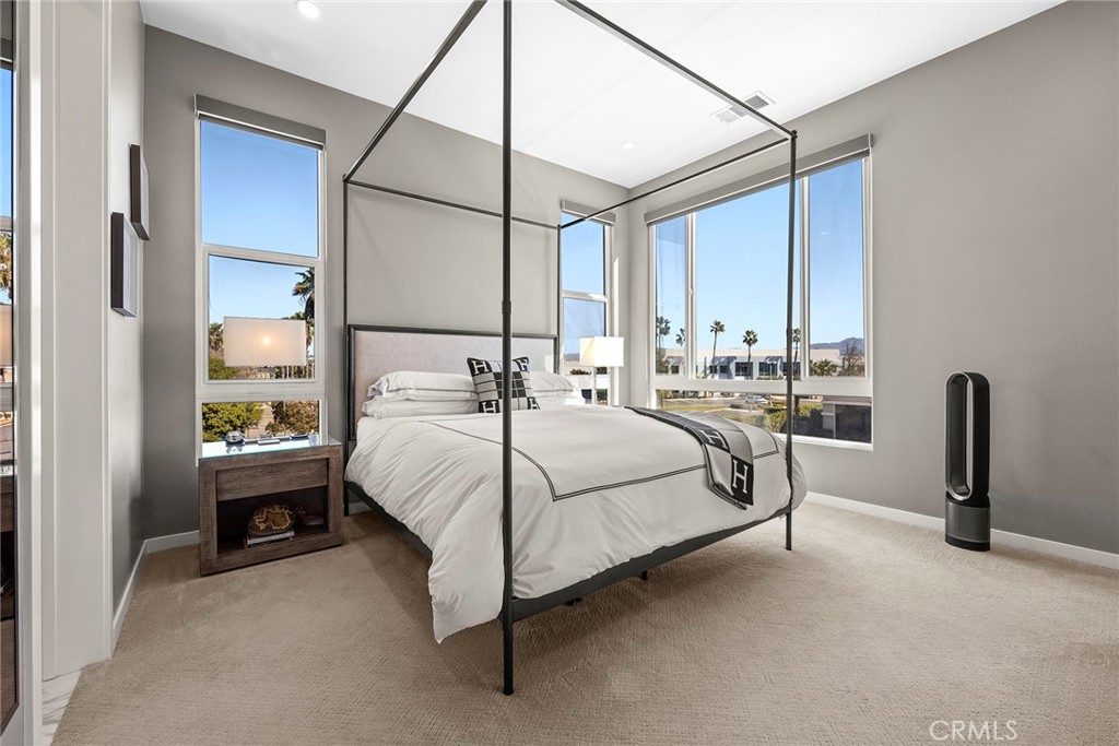 147 Schick Irvine, CA 92614 - Photo 24 of 35 a bedroom with a bed lamp and a window