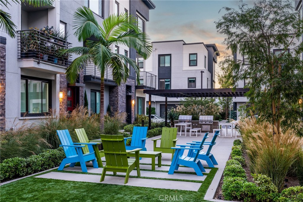 147 Schick Irvine, CA 92614 - Photo 33 of 35 a view of house with a chairs and table in a patio