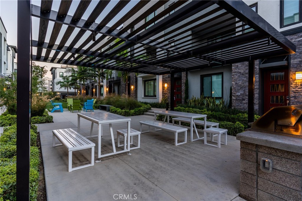 147 Schick Irvine, CA 92614 - Photo 35 of 35 a view of a patio with table and chairs potted plants and floor to ceiling window