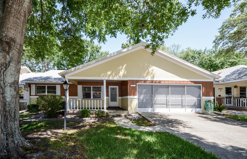 8665 Southwest 94 Street, Unit D Ocala, FL 34481 - Photo 1 of 1 a view of a house with backyard