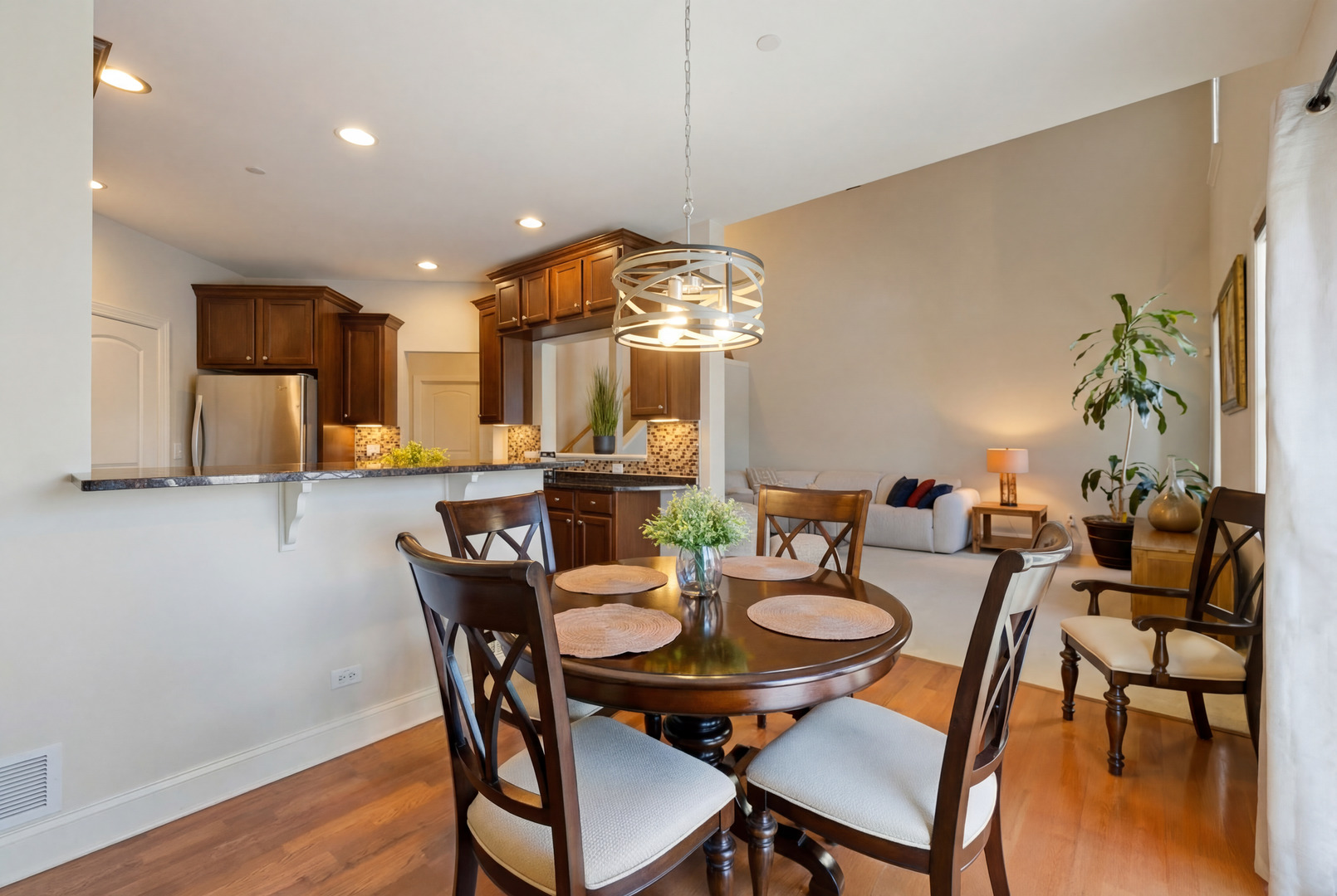 317 Nicole Way Itasca, IL 60143 - Photo 12 of 36 a view of a dining room with furniture and wooden floor