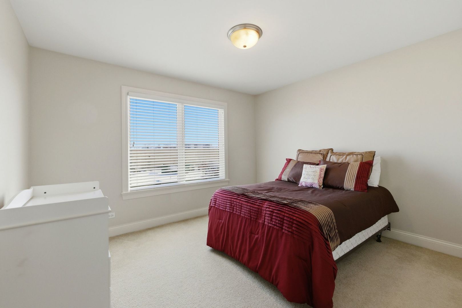 317 Nicole Way Itasca, IL 60143 - Photo 20 of 36 a bed sitting in a bedroom next to a window