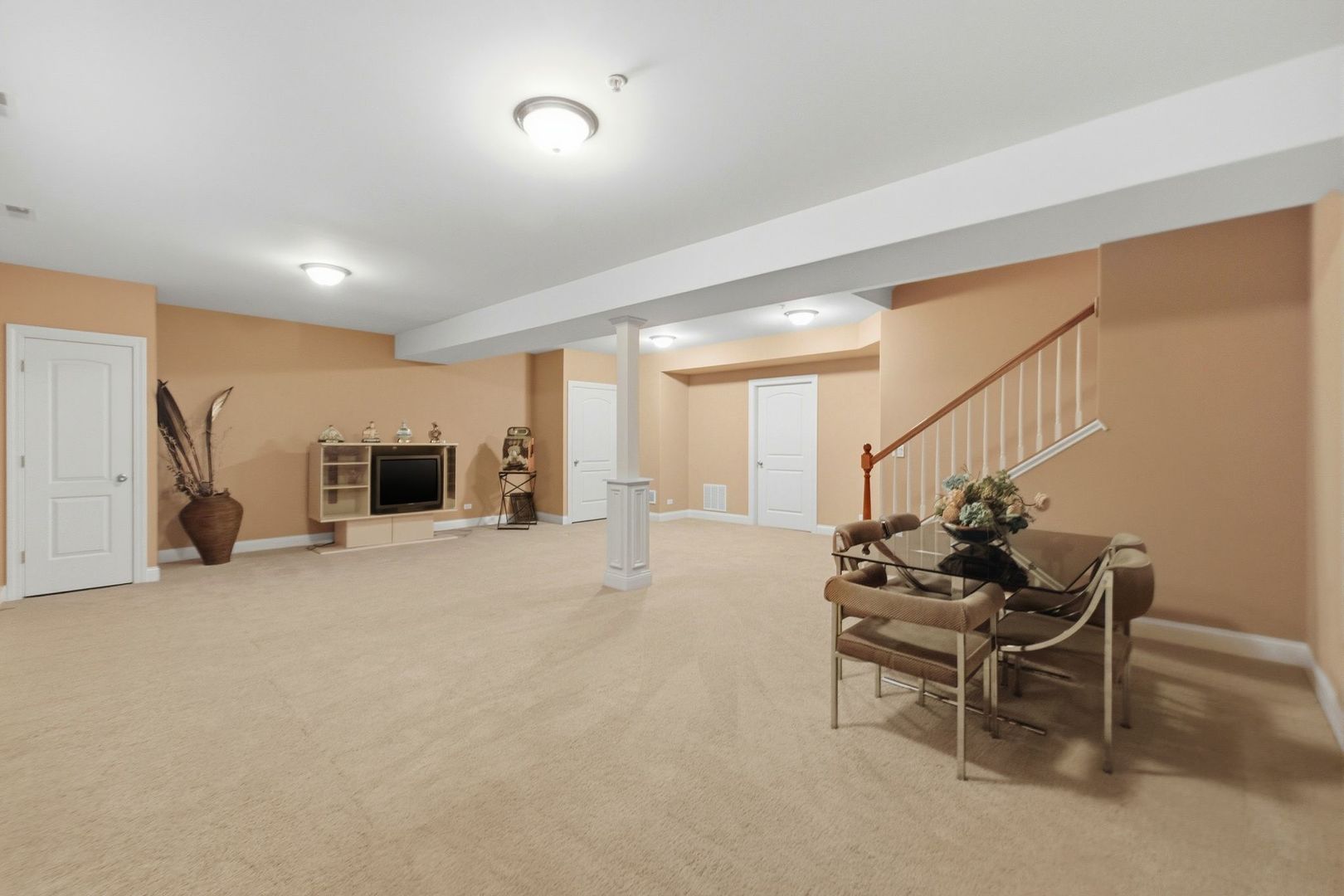 317 Nicole Way Itasca, IL 60143 - Photo 30 of 36 a living room with furniture and a flat screen tv