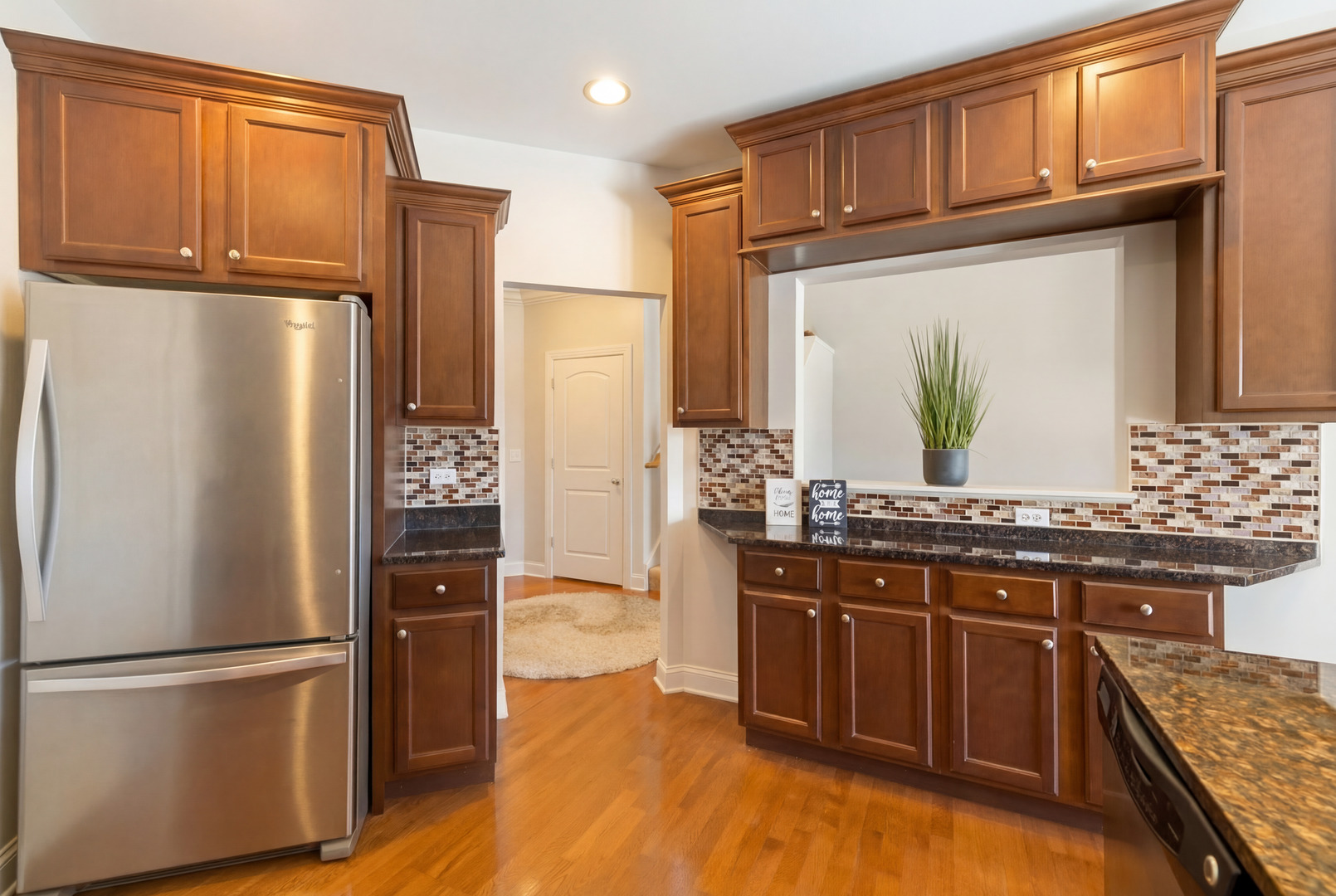 317 Nicole Way Itasca, IL 60143 - Photo 9 of 36 a kitchen with stainless steel appliances granite countertop a refrigerator and a stove