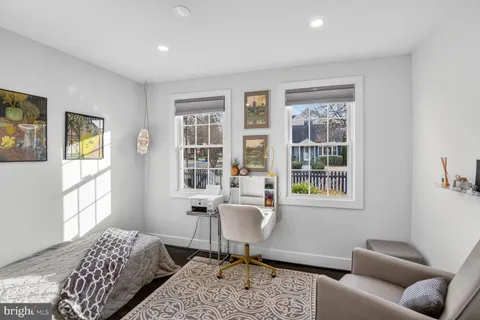 a workspace with furniture and a window