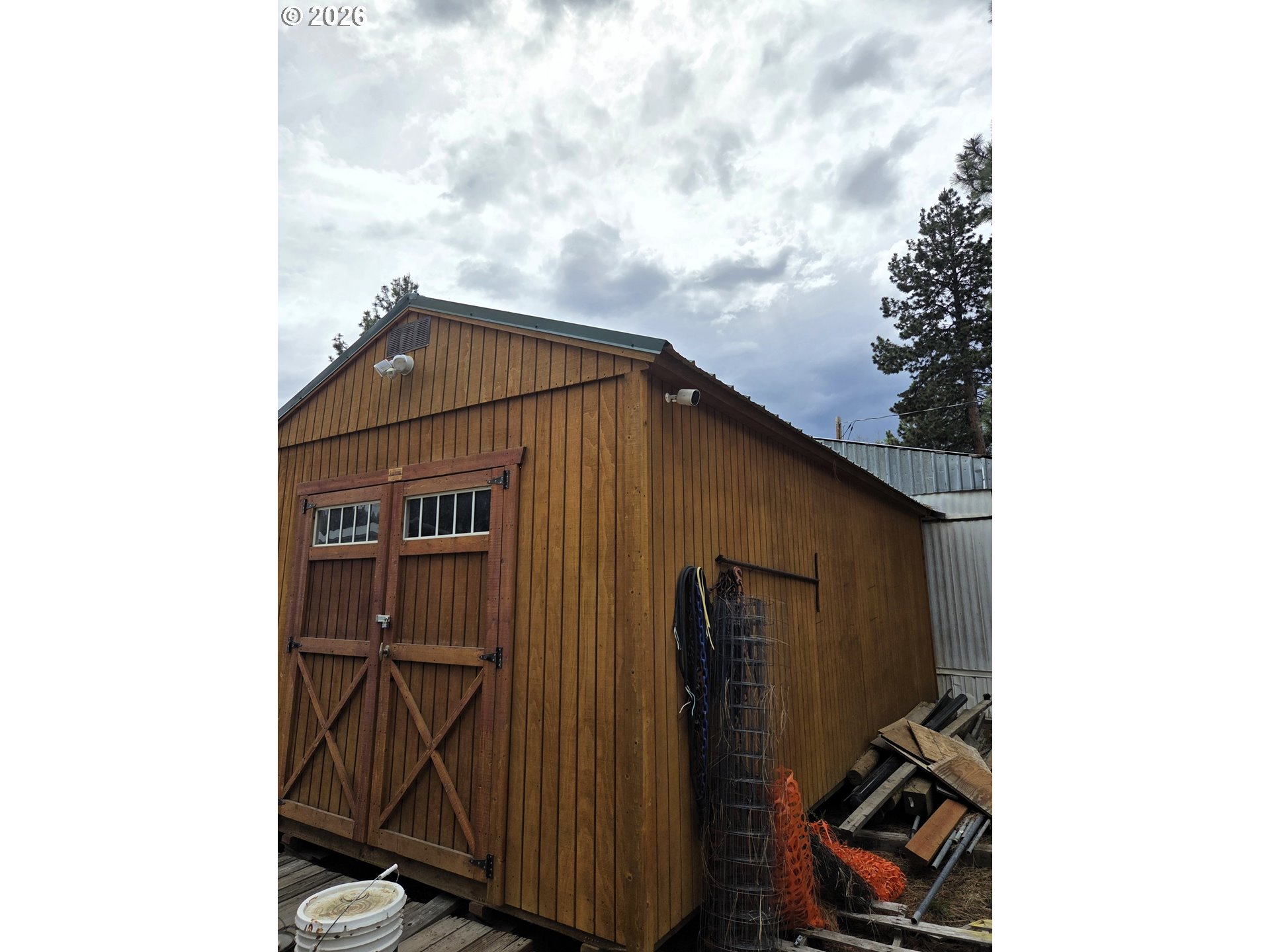 602 Mill Street Sumpter, OR 97877 - Photo 22 of 25 a blue house with a outdoor space