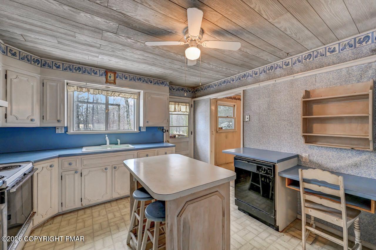 1912 Johns Road Effort, PA 18330 - Photo 11 of 44 a kitchen with a stove a sink and cabinets