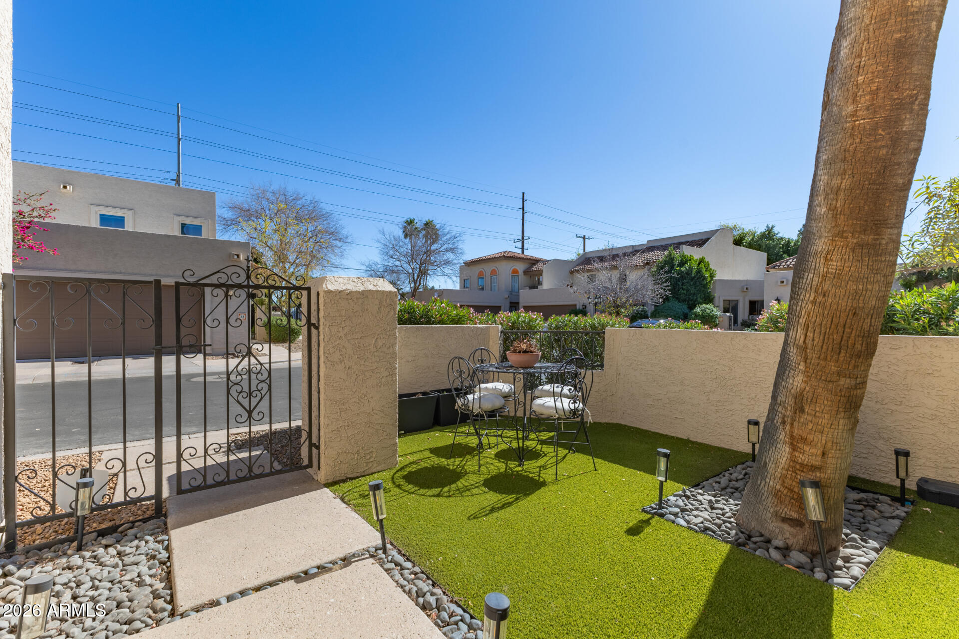5812 North 12th Street, Unit 34 Phoenix, AZ 85014 - Photo 2 of 39 a view of a chairs and table in patio