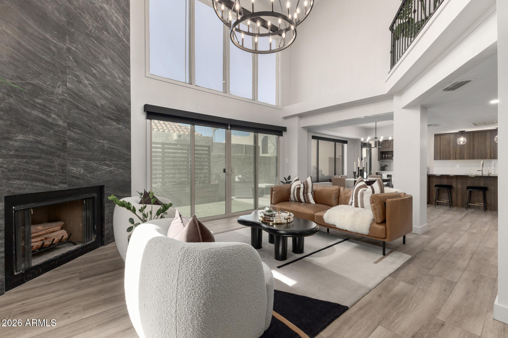 5812 North 12th Street, Unit 34 Phoenix, AZ 85014 - Photo 6 of 39 a living room with furniture a fireplace and a table