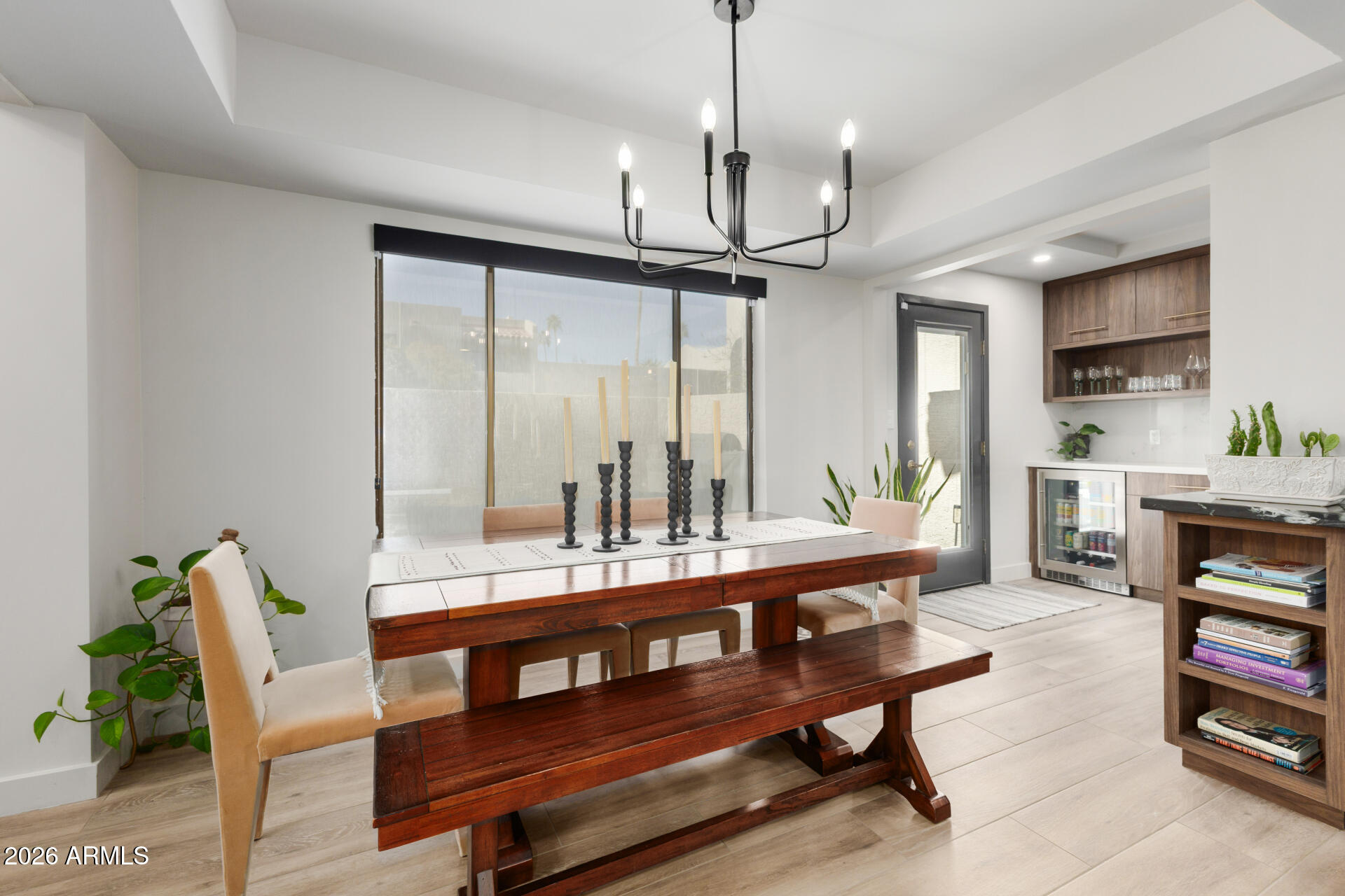 5812 North 12th Street, Unit 34 Phoenix, AZ 85014 - Photo 7 of 39 a view of a dining room with furniture window and wooden floor