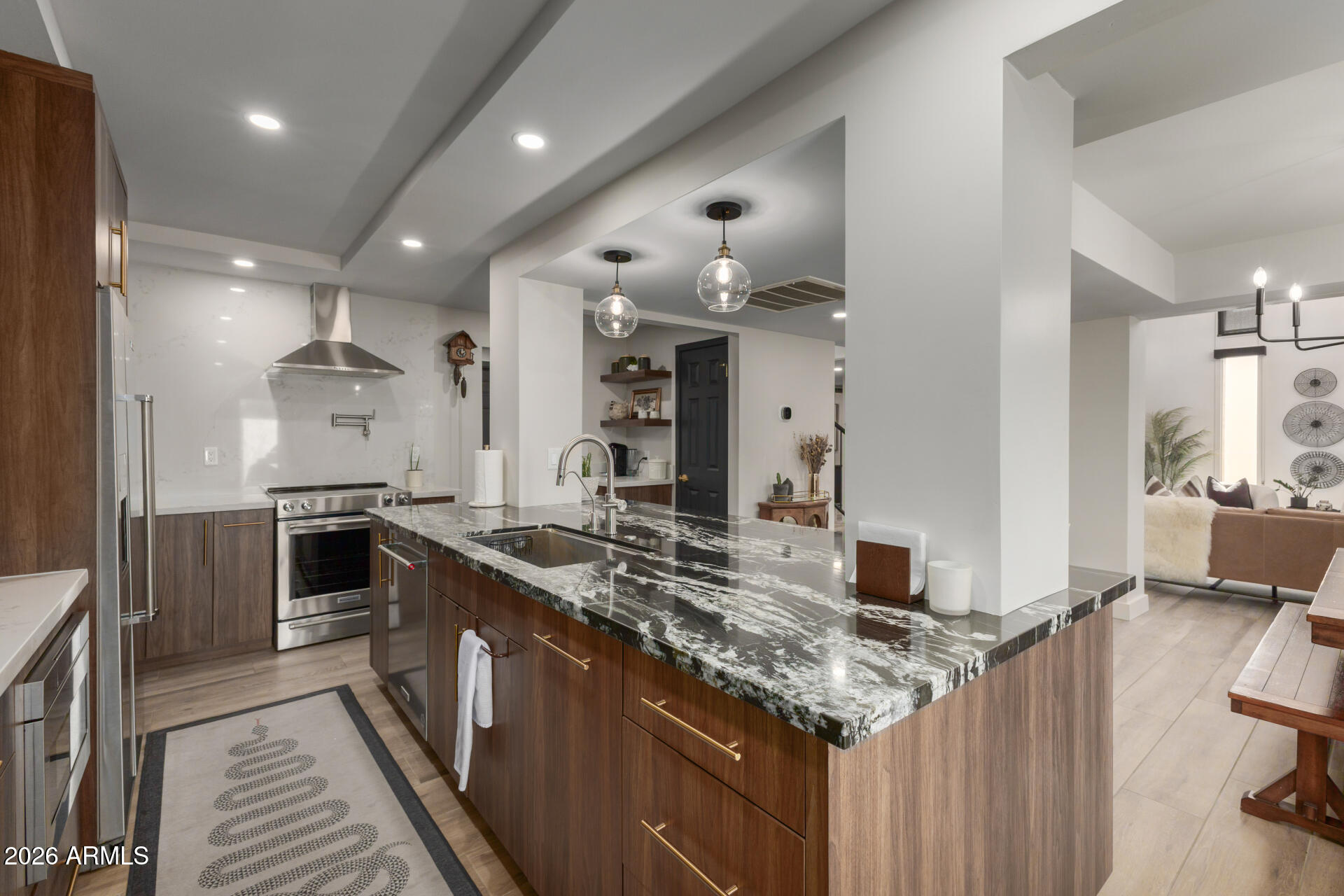 5812 North 12th Street, Unit 34 Phoenix, AZ 85014 - Photo 10 of 39 a kitchen with stainless steel appliances granite countertop a stove oven and a sink
