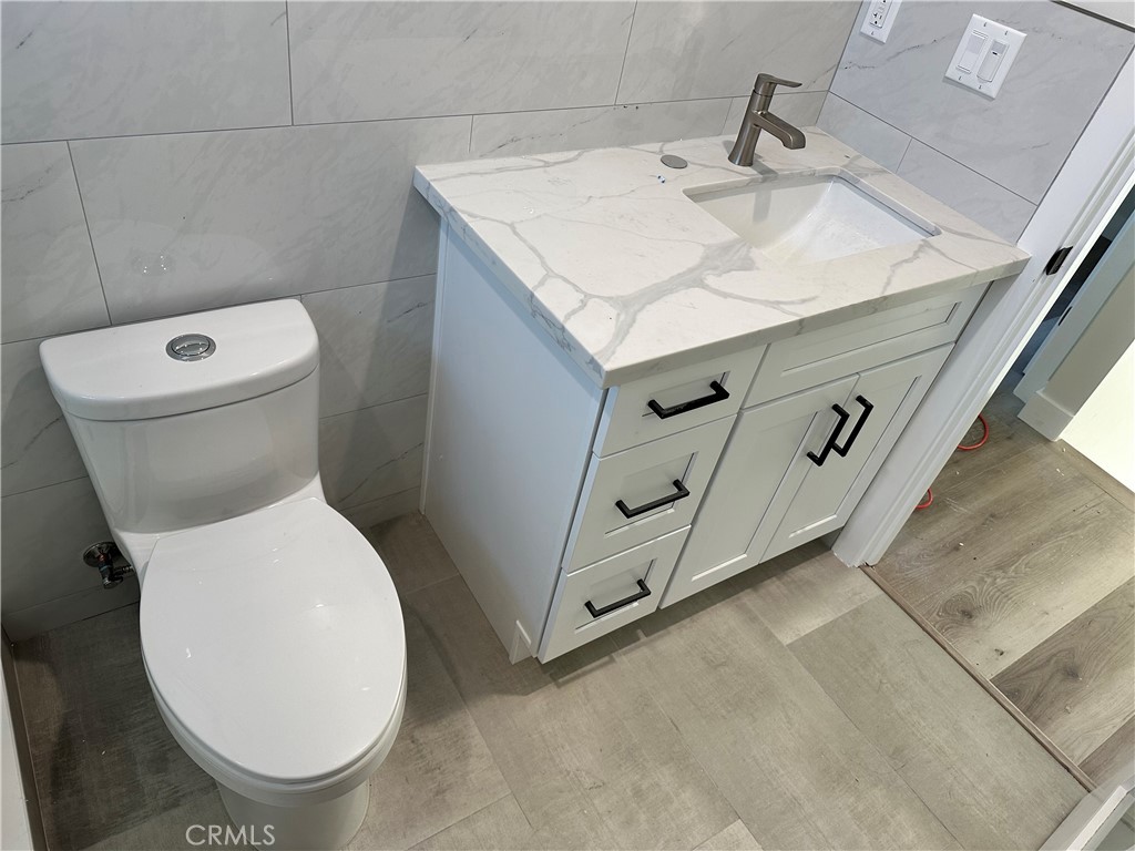 9585 Woodale Avenue Arleta, CA 91331 - Photo 13 of 21 a close view of a toilet in a bathroom