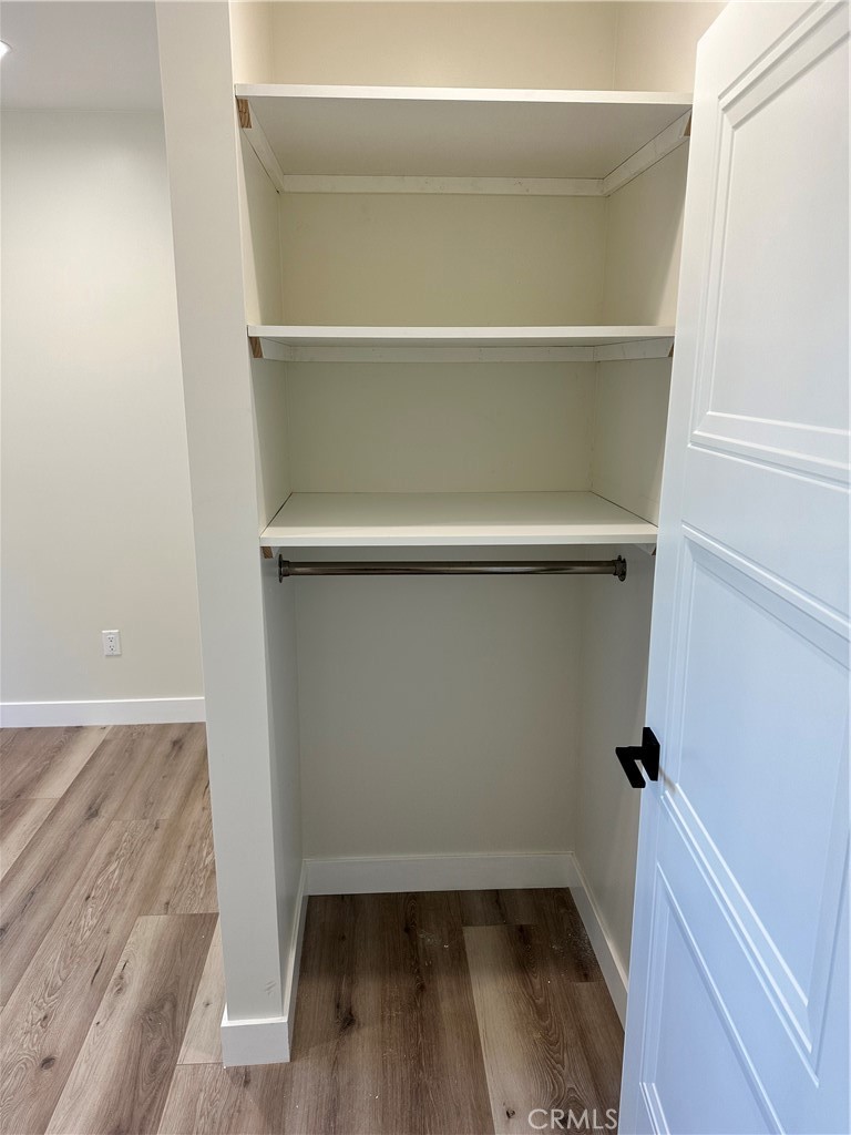 9585 Woodale Avenue Arleta, CA 91331 - Photo 16 of 21 a view of walk in closet with empty racks