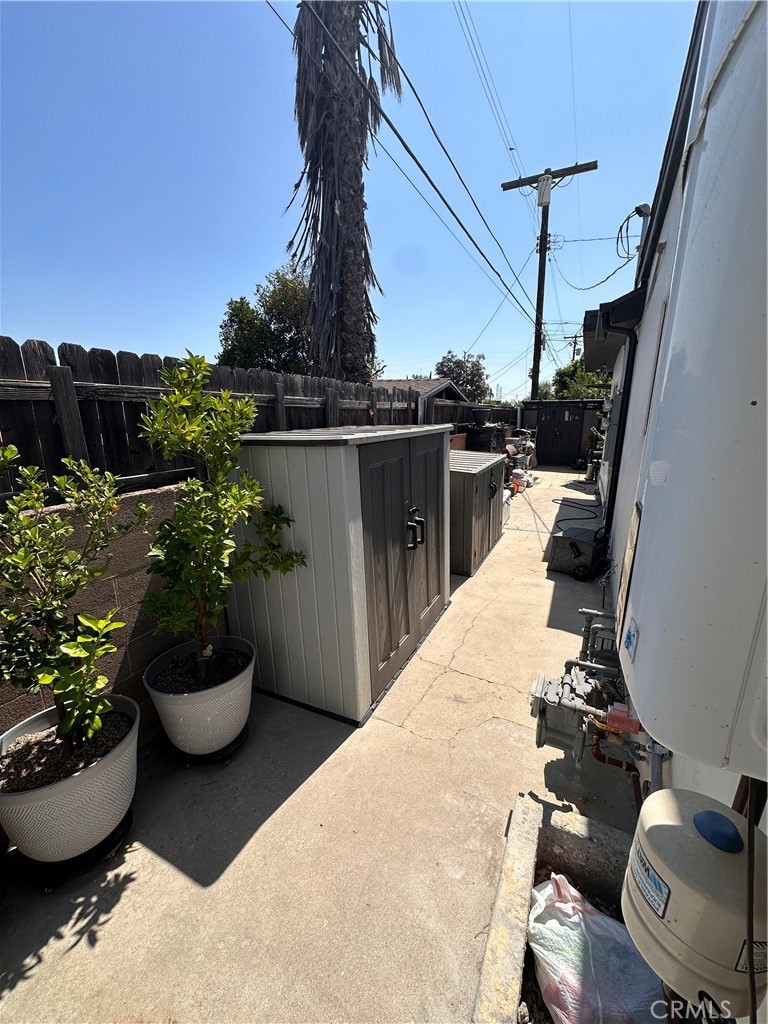9585 Woodale Avenue Arleta, CA 91331 - Photo 17 of 21 a view of a balcony with chair and potted plants