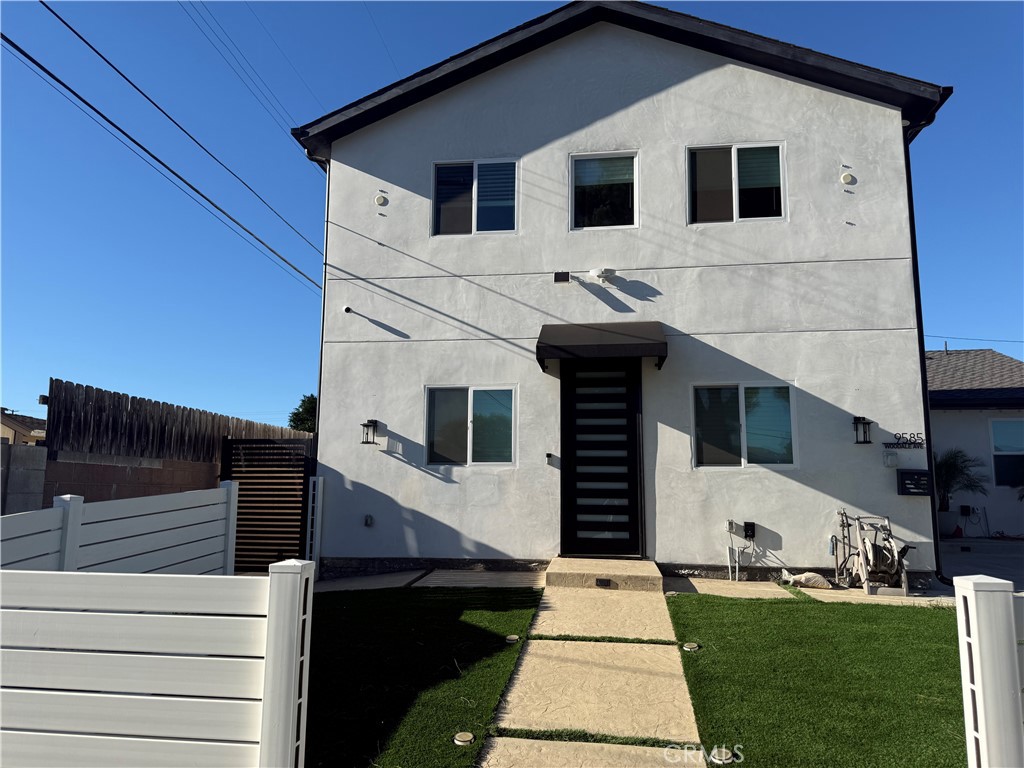 9585 Woodale Avenue Arleta, CA 91331 - Photo 20 of 21 a front view of a house with a yard