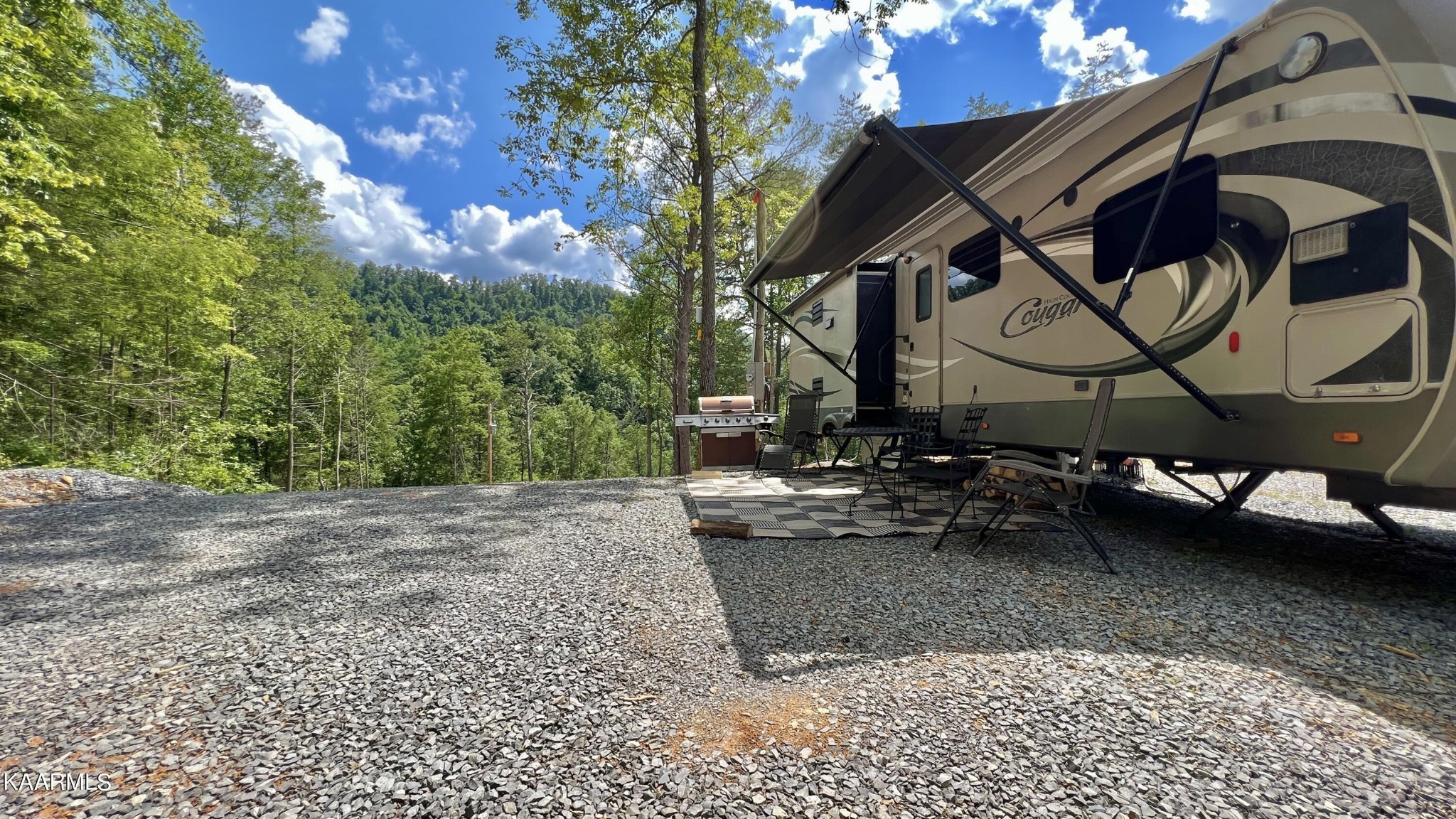 4965 Jones Cove Road Cosby, TN 37722 - Photo 25 of 50 a view of a slide with a bench in the patio