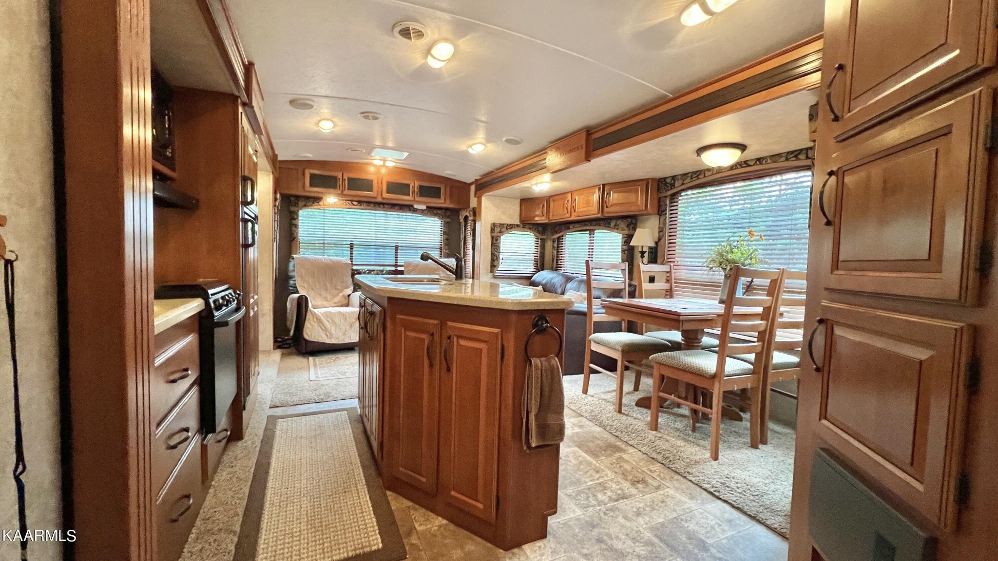 4965 Jones Cove Road Cosby, TN 37722 - Photo 37 of 50 a room with stainless steel appliances kitchen island granite countertop furniture and a view of living room