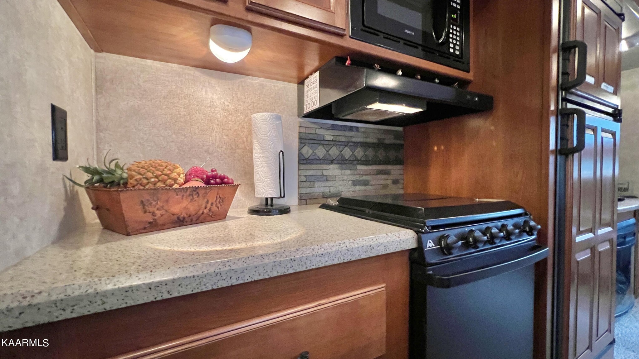 4965 Jones Cove Road Cosby, TN 37722 - Photo 38 of 50 a kitchen with a stove and cabinets