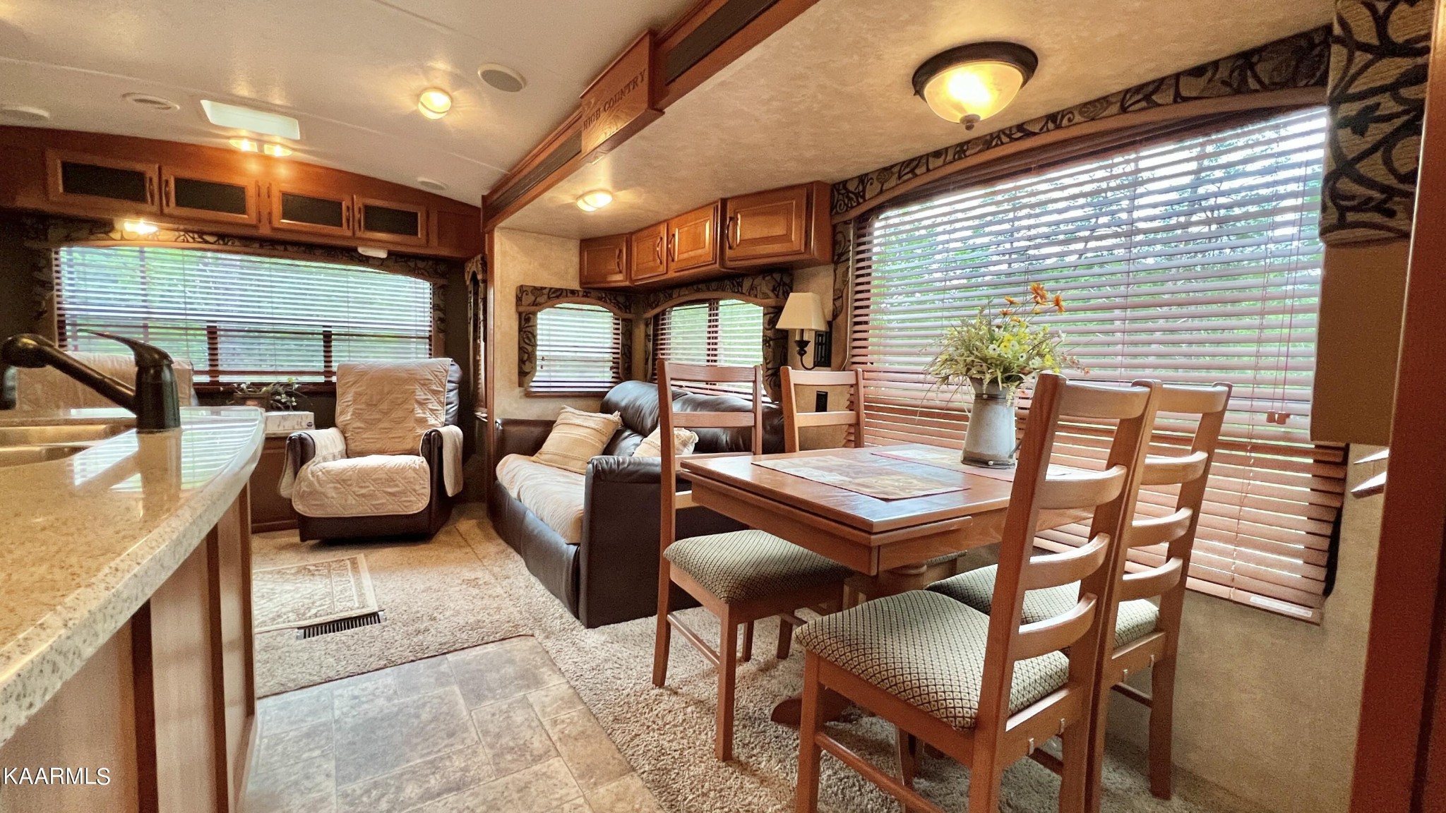 4965 Jones Cove Road Cosby, TN 37722 - Photo 39 of 50 a balcony with furniture and a large window