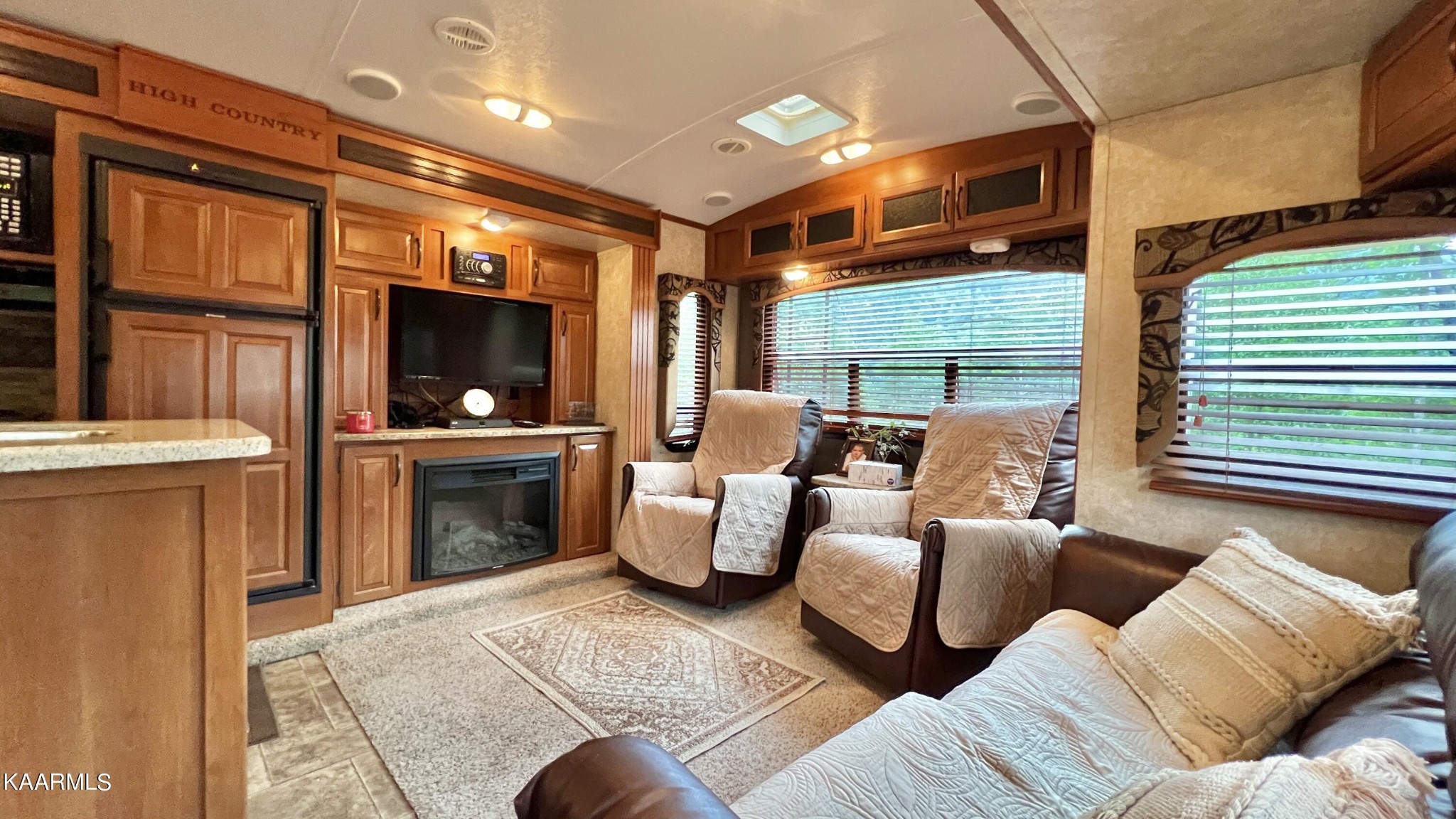 4965 Jones Cove Road Cosby, TN 37722 - Photo 41 of 50 a living room with furniture and a flat screen tv