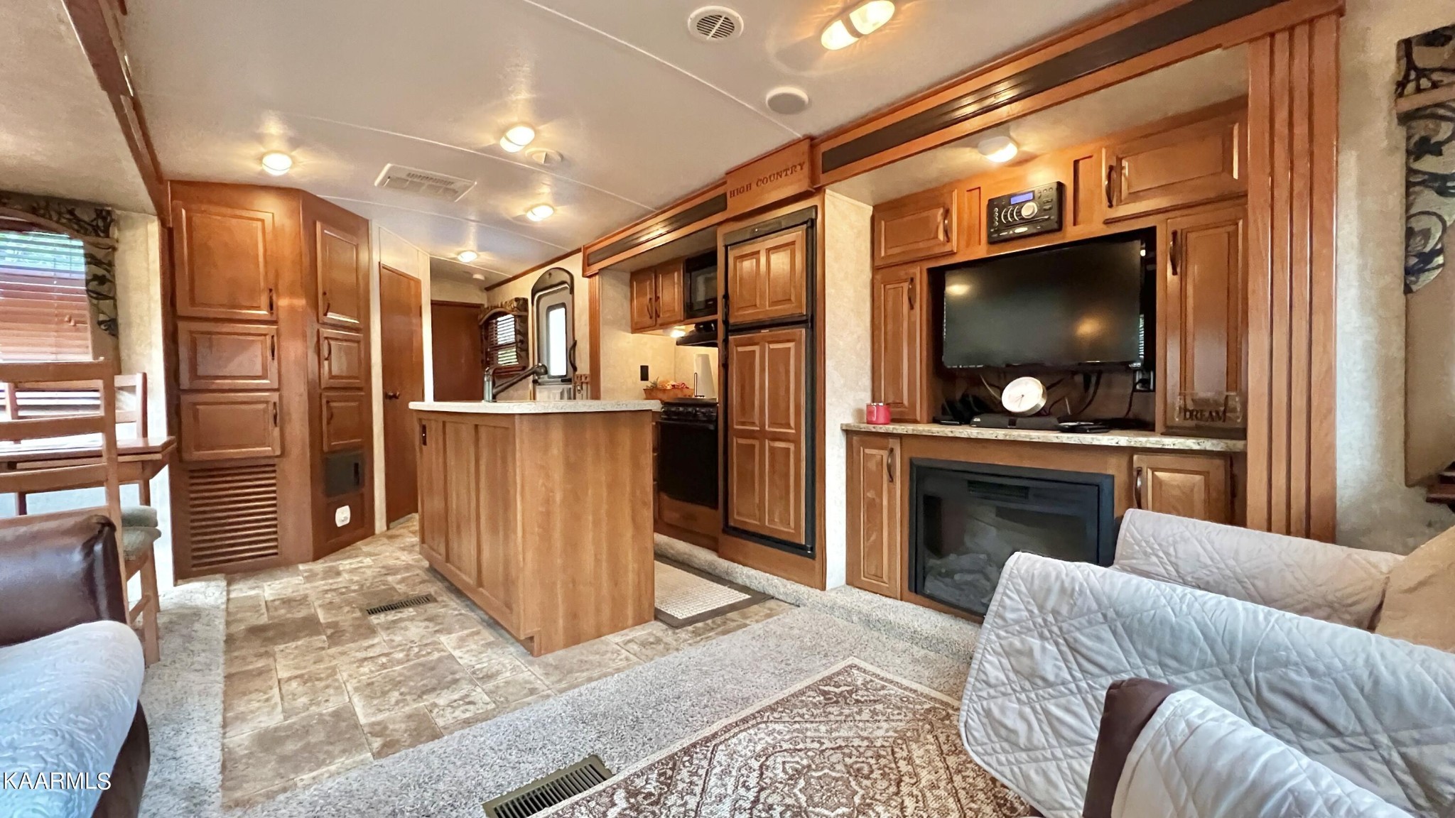4965 Jones Cove Road Cosby, TN 37722 - Photo 43 of 50 a living room with furniture and a flat screen tv