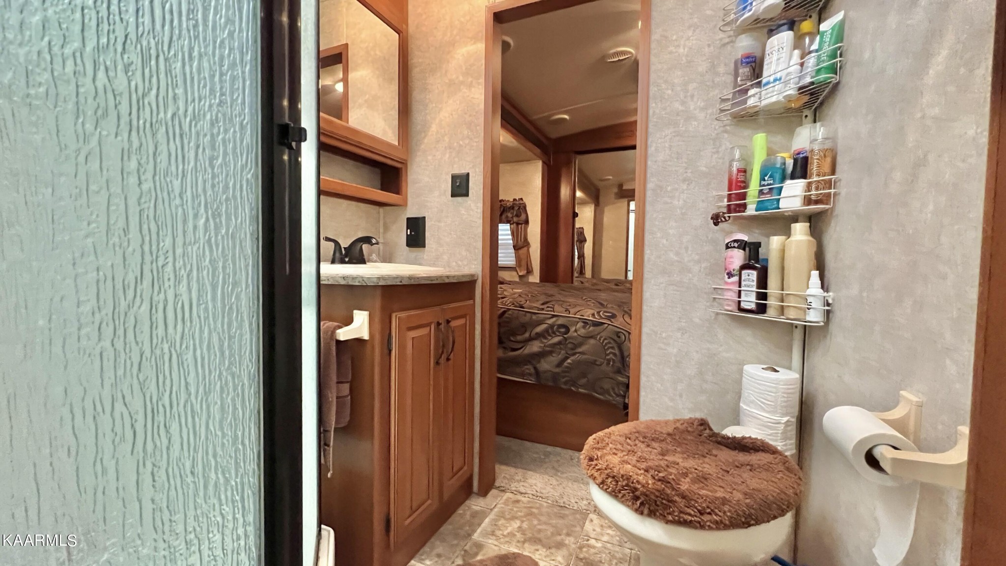 4965 Jones Cove Road Cosby, TN 37722 - Photo 45 of 50 a bathroom with a sink and a mirror