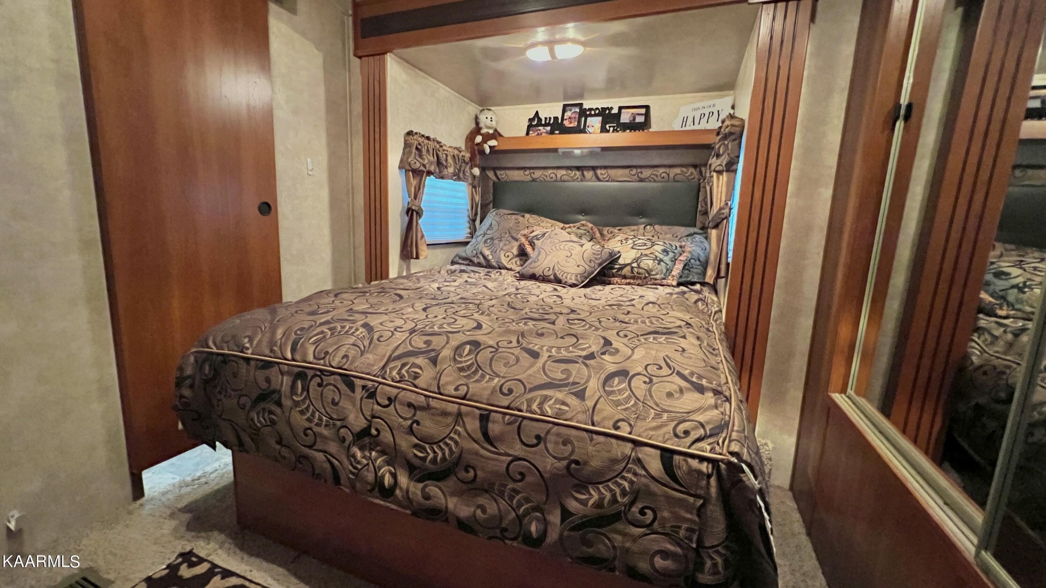 4965 Jones Cove Road Cosby, TN 37722 - Photo 47 of 50 a bed sitting in a bedroom next to a window