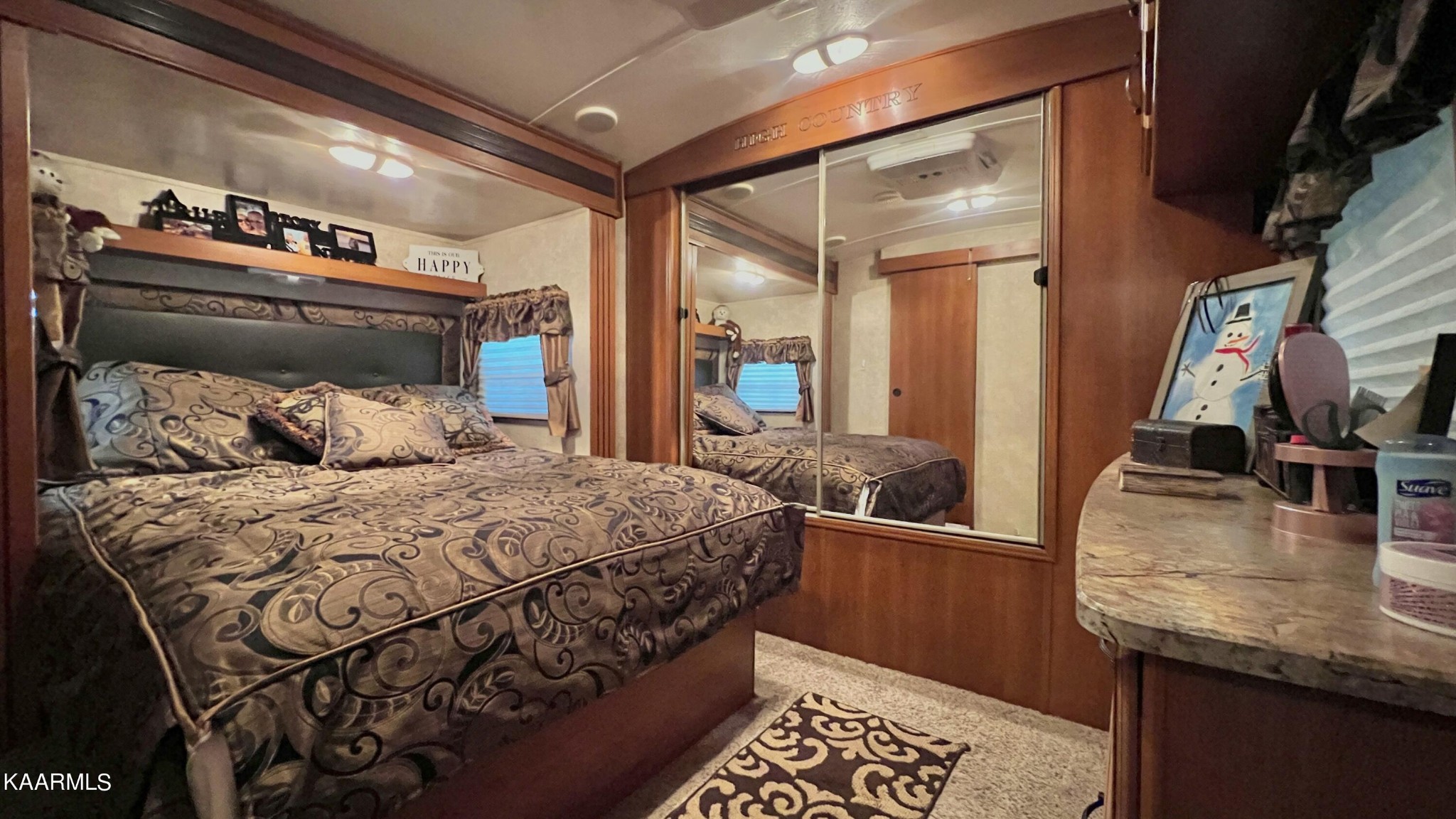 4965 Jones Cove Road Cosby, TN 37722 - Photo 49 of 50 a bedroom with a bed and a walk in closet