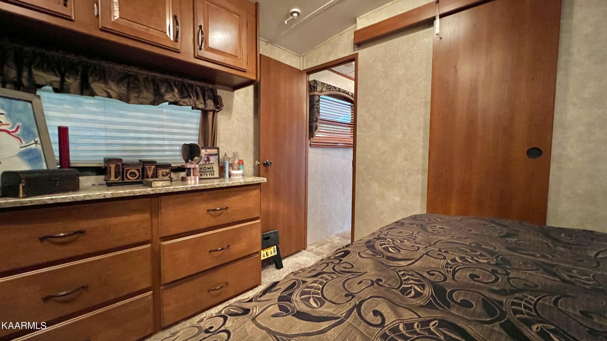 4965 Jones Cove Road Cosby, TN 37722 - Photo 50 of 50 a bedroom with a bed and a dresser