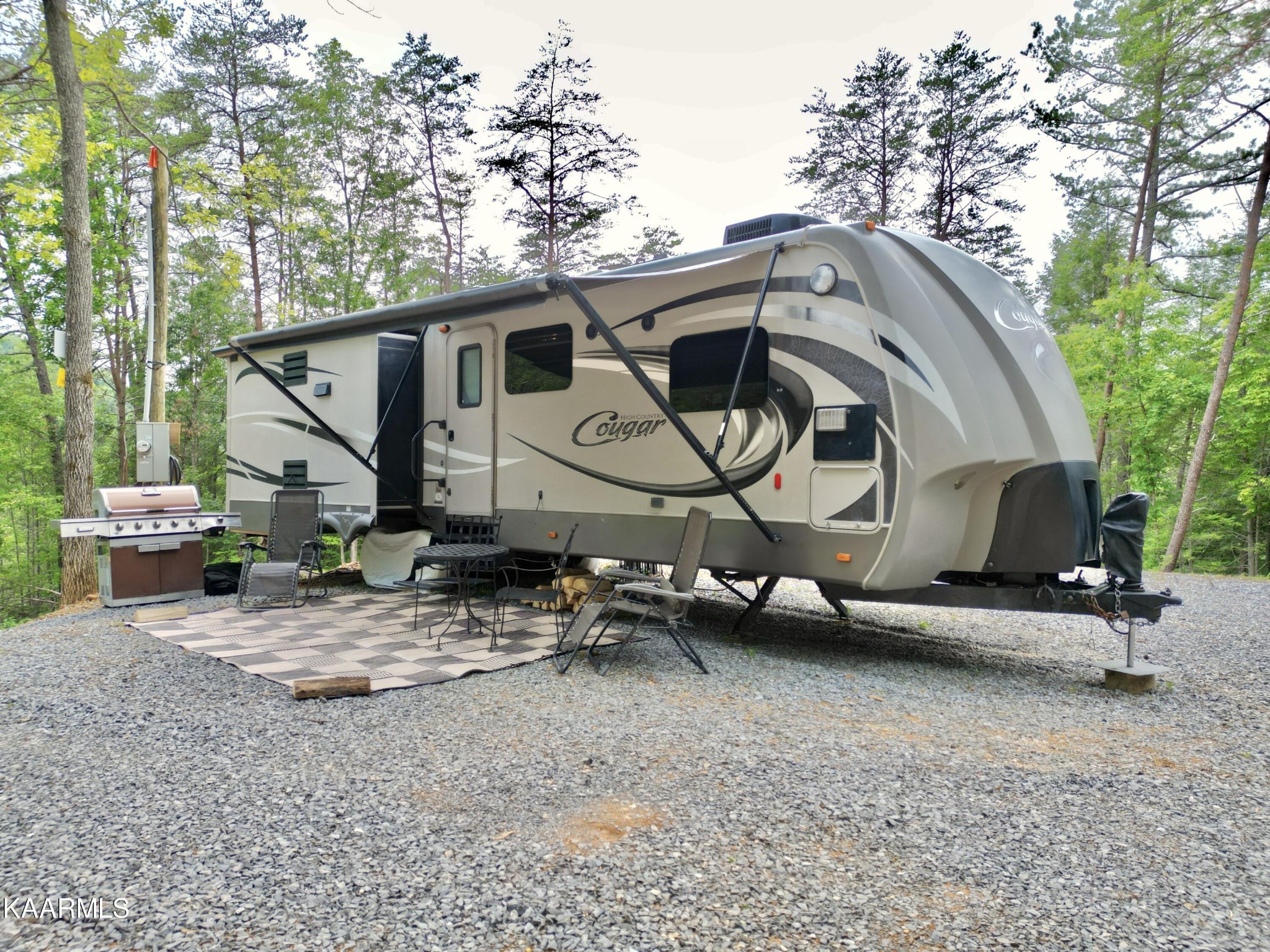 4965 Jones Cove Road Cosby, TN 37722 - Photo 7 of 50 a house with trees in the background