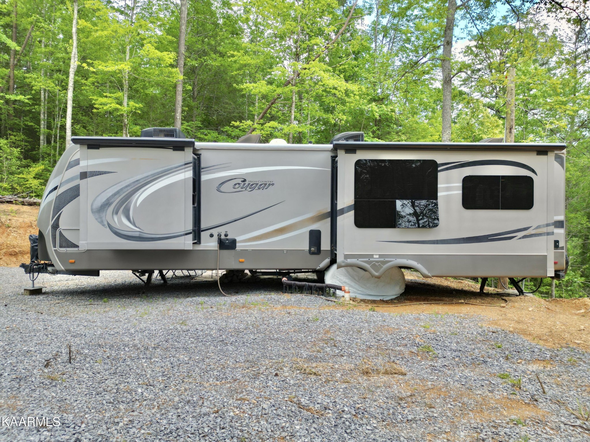 4965 Jones Cove Road Cosby, TN 37722 - Photo 10 of 50 a backyard of a house with barbeque oven