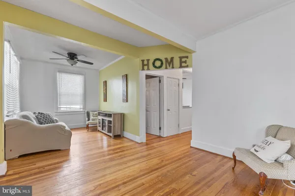 a view of an empty room and wooden floor