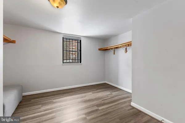 a view of room with wooden floor and window