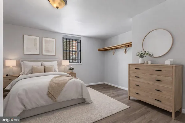 a bedroom with a bed and a dresser