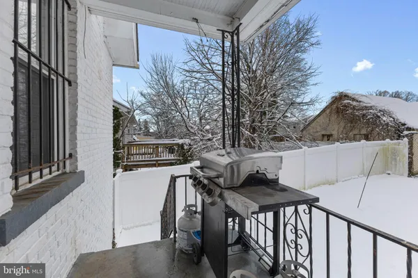 a view of a chairs and table in the balcony