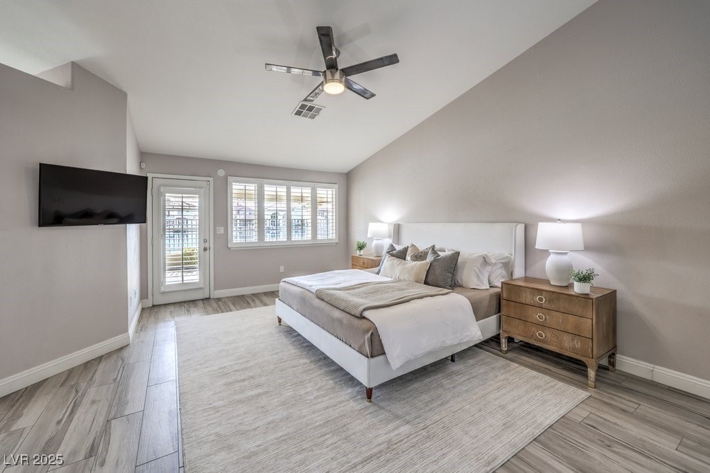 2432 Ocean Front Drive Las Vegas, NV 89128 - Photo 24 of 53 Bedroom featuring access to exterior, lofted ceiling, light wood finished floors, and ceiling fan