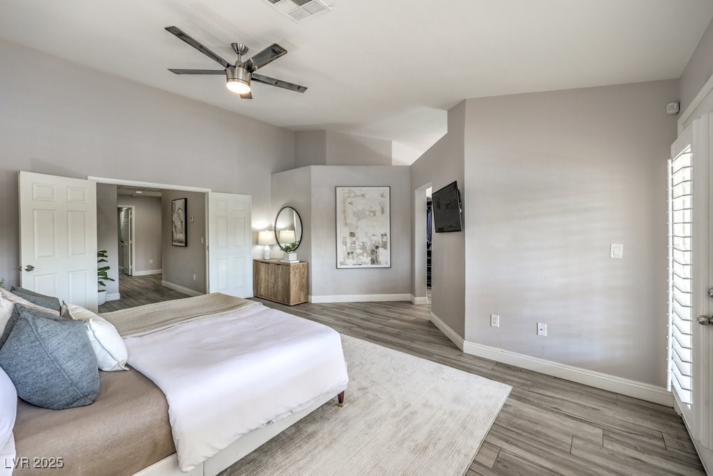 2432 Ocean Front Drive Las Vegas, NV 89128 - Photo 25 of 53 Bedroom featuring light wood-style flooring and a ceiling fan