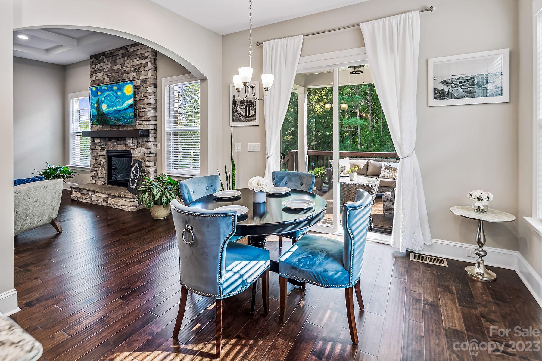 1004 Princessa Drive Wesley Chapel, NC 28104 - Photo 15 of 40 a view of a dining room with furniture window and wooden floor
