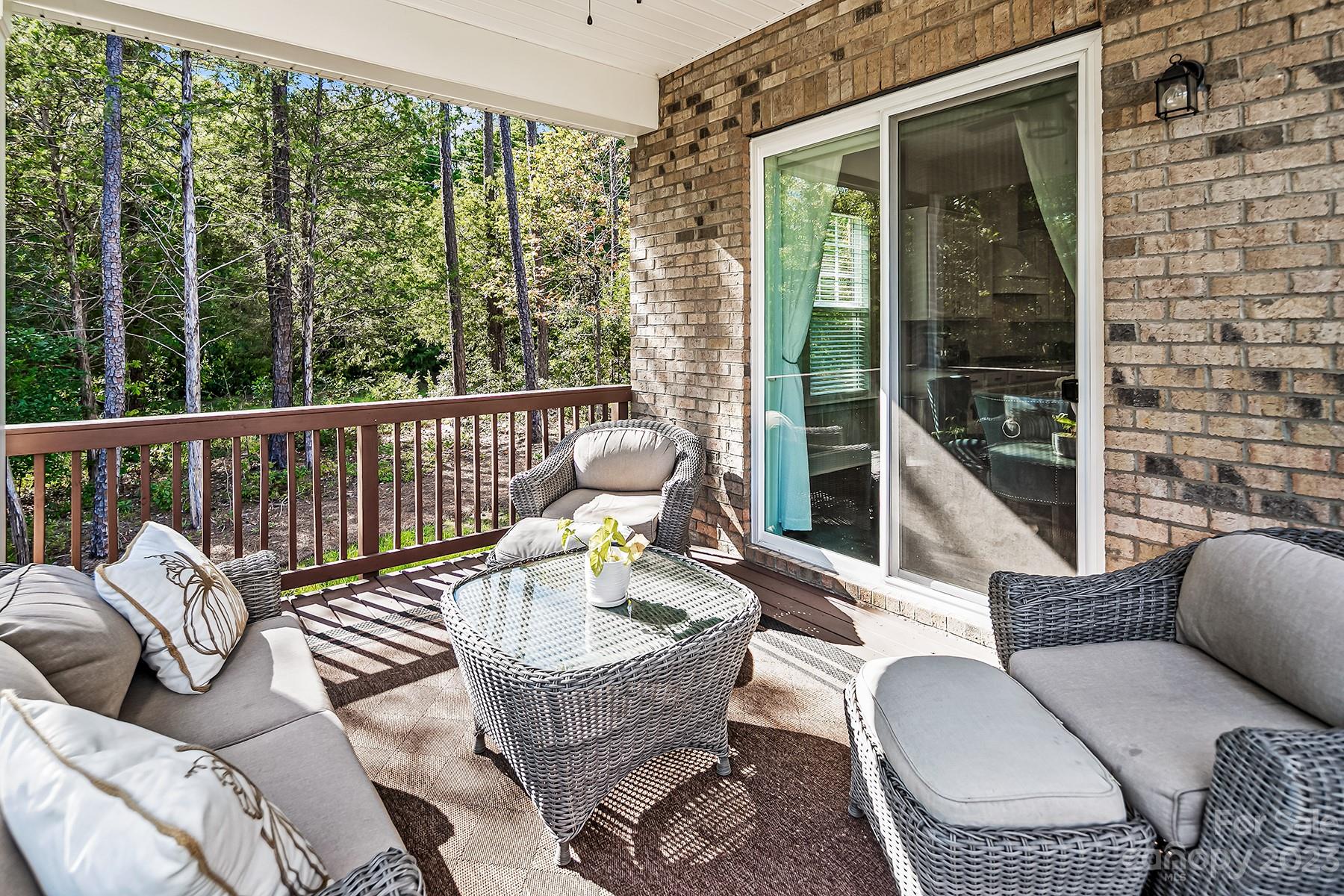 1004 Princessa Drive Wesley Chapel, NC 28104 - Photo 34 of 40 a view of balcony with couch and chairs