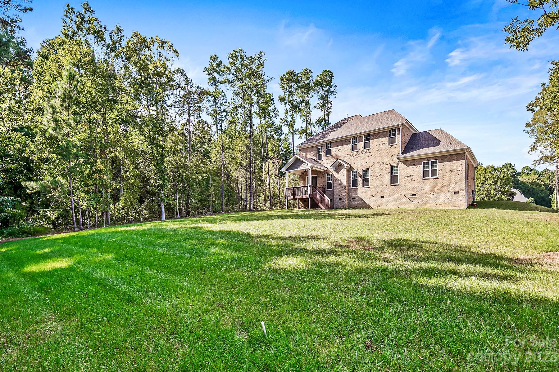 1004 Princessa Drive Wesley Chapel, NC 28104 - Photo 36 of 40 a view of a house with a yard