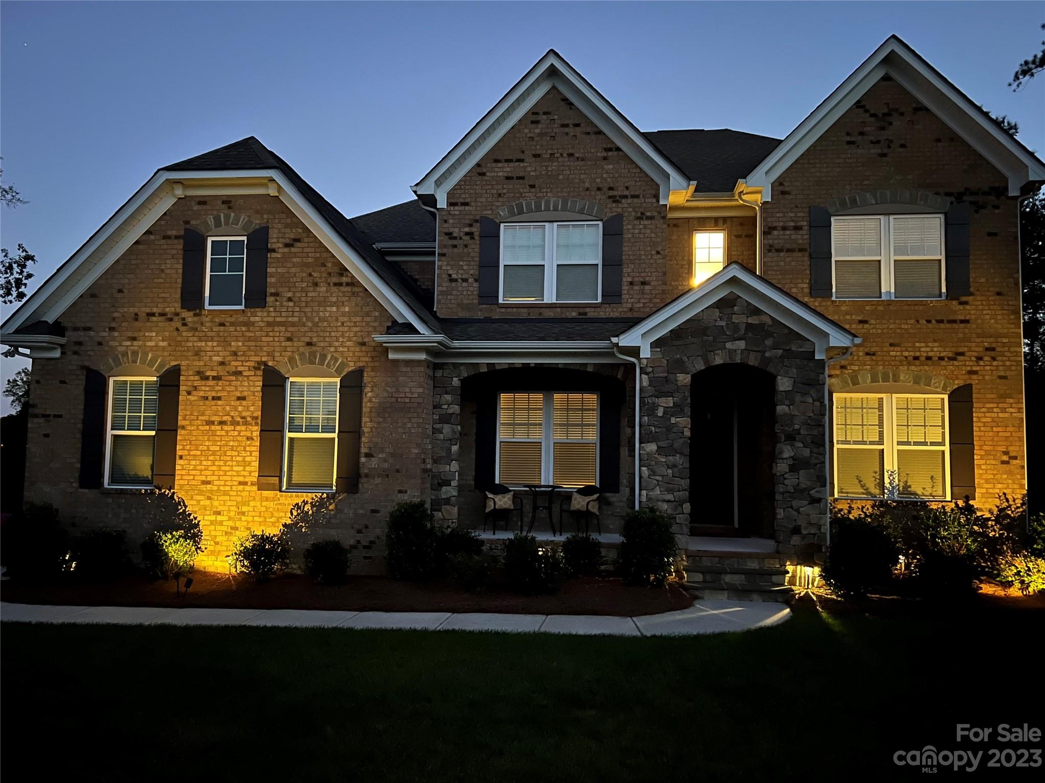 1004 Princessa Drive Wesley Chapel, NC 28104 - Photo 4 of 40 a front view of a house with a yard