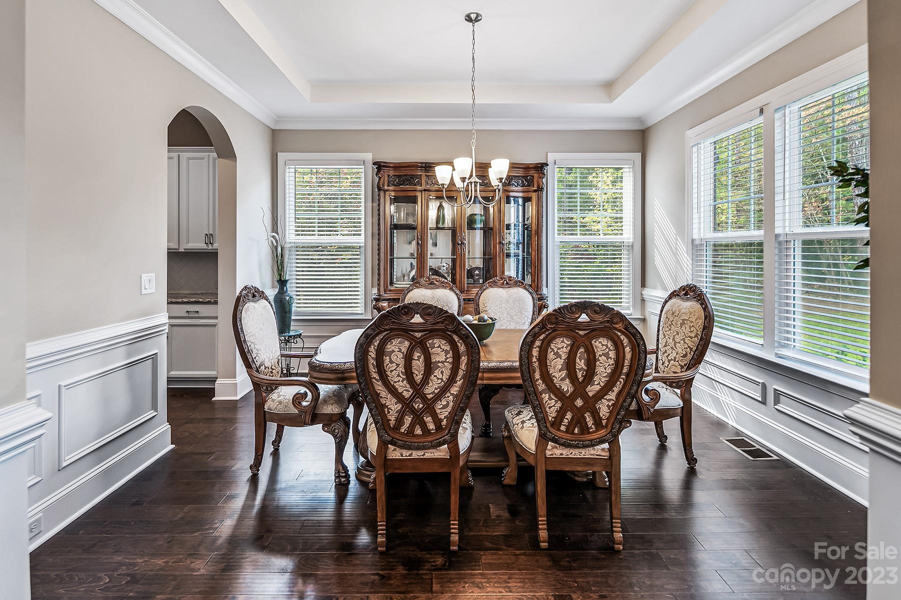 1004 Princessa Drive Wesley Chapel, NC 28104 - Photo 8 of 40 a view of a dining room with furniture window and wooden floor