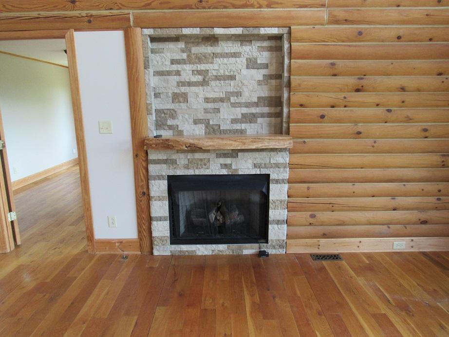 449 Laurel Creek Road Northeast Pilot, VA 24138 - Photo 15 of 72 449 Laurel Creek family room fireplace