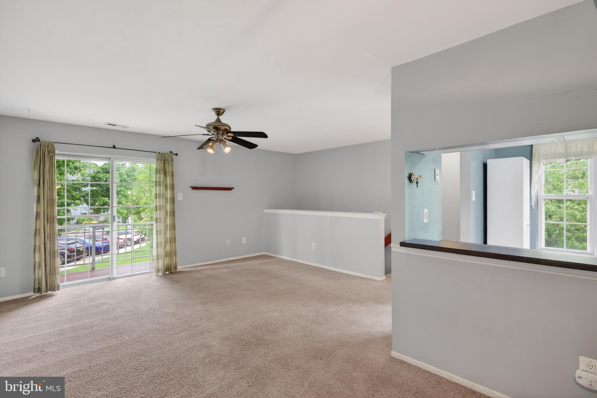 3302 B Ramsbury Court Mount Laurel, NJ 08054 - Photo 8 of 16 a view of a livingroom with a ceiling fan and window