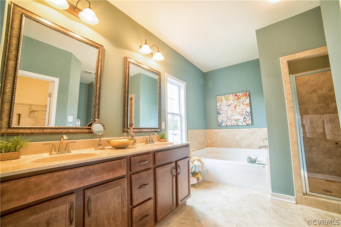 10806 Avening Road Chesterfield, VA 23832 - Photo 14 of 24 a bathroom with a tub sink and mirror