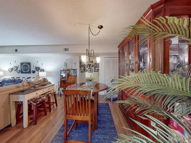 a bed room with a bed and a chandelier