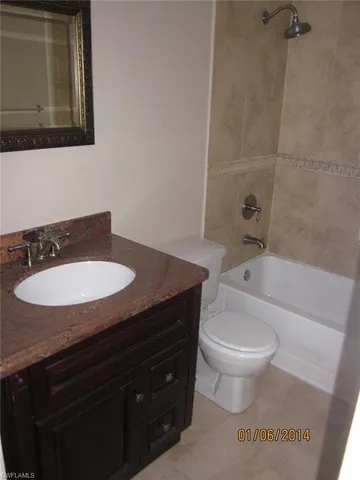 an aerial view of a house with a swimming pool