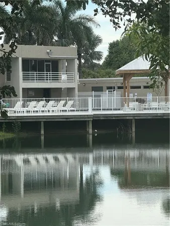 a view of a swimming pool with outdoor seating