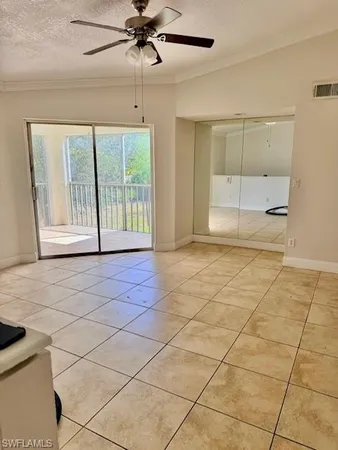 a view of an empty room and a window